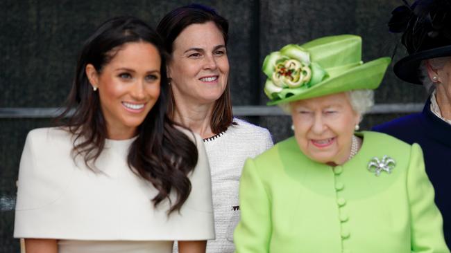 Meghan Markle and Queen Elizabeth II, accompanised by Samantha Cohen, in 2018. Ms Cohen later went to work for Boris Johnson. Picture: Max Mumby/Getty