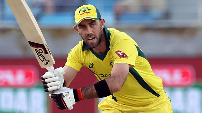 Australian cricketer Glenn Maxwell (L) plays a shot during the fourth one day international (ODI) cricket match between Pakistan and Australia at Dubai International Stadium in Dubai on March 29, 2019. (Photo by MAHMOUD KHALED / AFP)