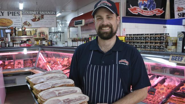 Grays Modern Meat Mart owner Michael Needham with the business' award-winning bacon. The business won the title of Australia's best bacon at the 2024 Australian Charcuterie Excellence Awards.