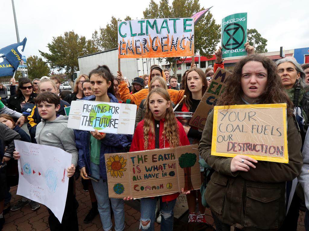 Adelaide Students protest their concerns about climate inaction outside the offices of Liberal Senator Simon Birmingham in Adelaide. Picture: AAP Image/Kelly Barnes