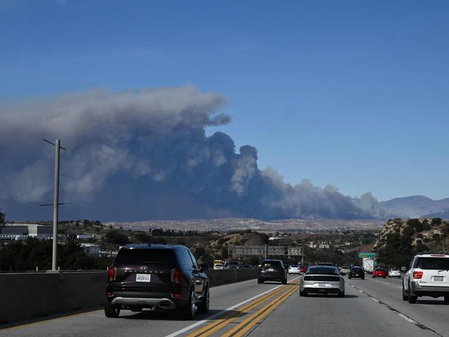 Smoke is visible near Santa Clarita, with forecasters warning of an “extremely critical” risk in a region already staggering from the devastation of horrifying blazes. Picture: AFP