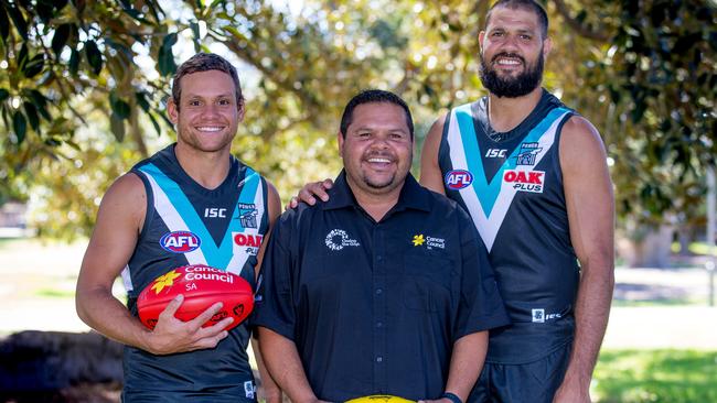 Motlop and Ryder with the Cancer Council of SA's Peter Thomas who are concerned about the rate of smoking among indigenous people. Picture: Mark Piovesan.