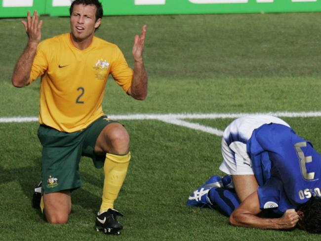 20/12/2006 LIBRARY: Australian soccer player Lucas Neill (2) reacts after he tackled Italian Fabio Grosso in the penalty box during the last minutes of the Australia Socceroos v Italy World Cup soccer match at Fritz Walter Stadium in Kaiserslautern, Germany, 26 Jun 2006. Italy was awarded a penalty and won the match.