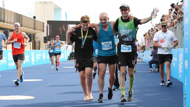 The camaraderie among entrants at the finish line of last year’s Gold Coast Marathon. Picture Mike Batterham