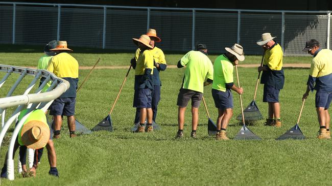 BCM News. Workers repairing the track at Eagle Farm racecourse. Western (Kitchener Rd) side of track looking North to South. Picture from Gordon St trainers entrance.