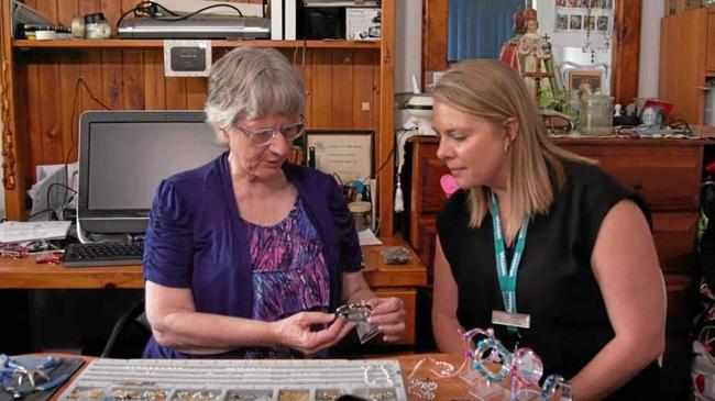 HOME HELP PRICELESS: Margaret Lee shows Rebecca Elks jewellery she created at a speciality table thanks to her home care package. Picture: The Whiddon Group