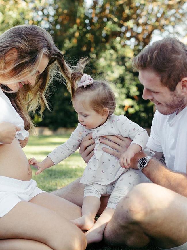 Tahlia Giumelli, with daughter Sophie and partner Tom Burgess, announces her pregnancy on Instagram.