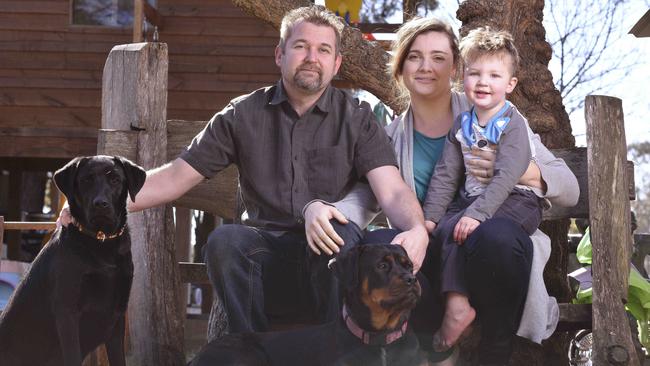 Paramedic Andrew Brooker, who is being honoured with an award for bravery, with wife Laura Brooker and son Luca Brooker. Picture: Flavio Brancaleone