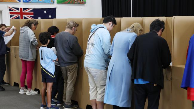 Voting in the Melbourne teal seat of Kooyong on May 3. A low turnout and high informal vote nationally coincided with historically low primary votes for Labor and the Coalition. Picture: David Crosling