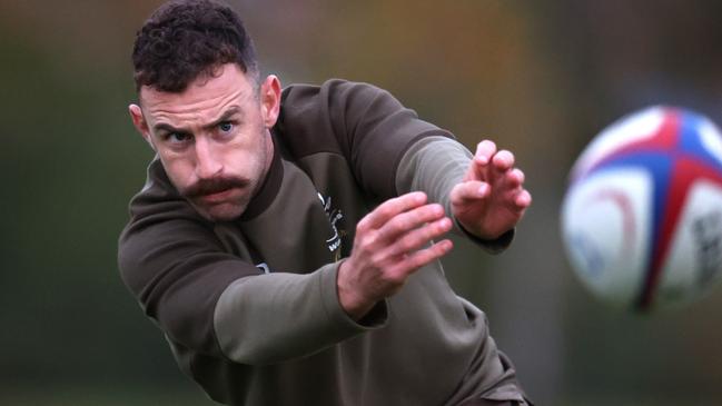 TEDDINGTON, ENGLAND - NOVEMBER 09: Nic White passes the ball during an Australia Rugby Training Session ahead of their International Match against England. At The Lensbury on November 09, 2021 in Teddington, England. (Photo by Alex Pantling/Getty Images)