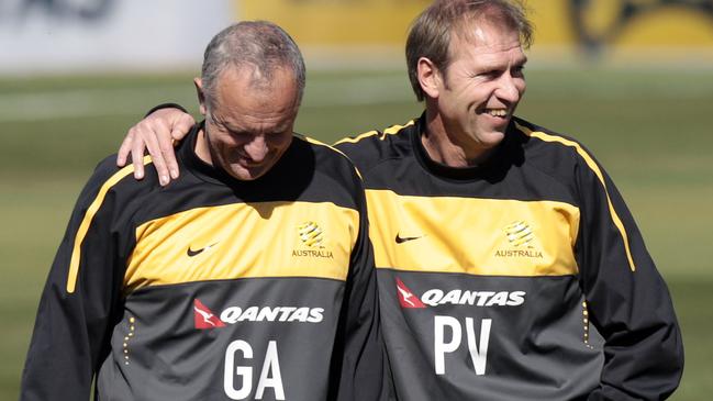 Pim Verbeek, right, and Graham Arnold share a laugh during a World Cup training session in 2010. Picture: AP