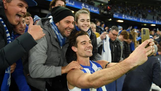 Jy Simpkin celebrates the Kangaroos’ second win of the season with fans. Picture: Morgan Hancock/AFL Photos/via Getty Images