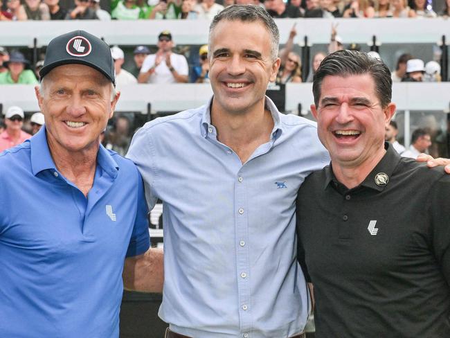 From L-R: Australia's former golfer Greg Norman, South Australia's Premier Peter Malinauskas, and LIV Golf CEO Scott O'Neil pose as they announce Adelaide securing the tournament until 2031, during the final day of the LIV Golf Adelaide at the Grange Golf Club in Adelaide on February 16, 2025. (Photo by Brenton Edwards / AFP) / -- IMAGE RESTRICTED TO EDITORIAL USE - STRICTLY NO COMMERCIAL USE --