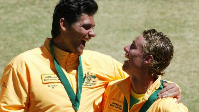 Mark Phililppoussis and Lleyton Hewitt after winning the Davis Cup in 2003. Picture: Craig Borrow