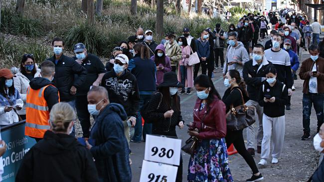 Sydneysiders wait to be vaccinated at Sydney Olympic Park in Homebush. Picture: Adam Yip