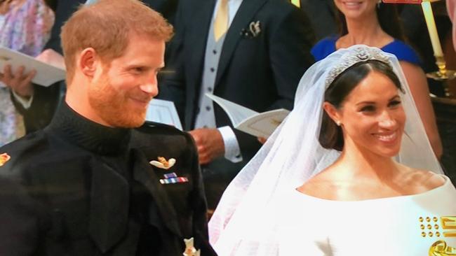 Harry and Meghan are all smiles.