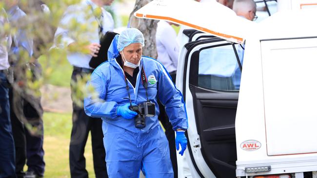 A police forensics officer at the scene. Picture: Adam Head.