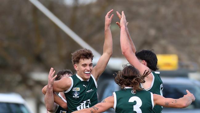 Cody Walker is mobbed by teammates after kicking a goal. Picture Yuri Kouzmin