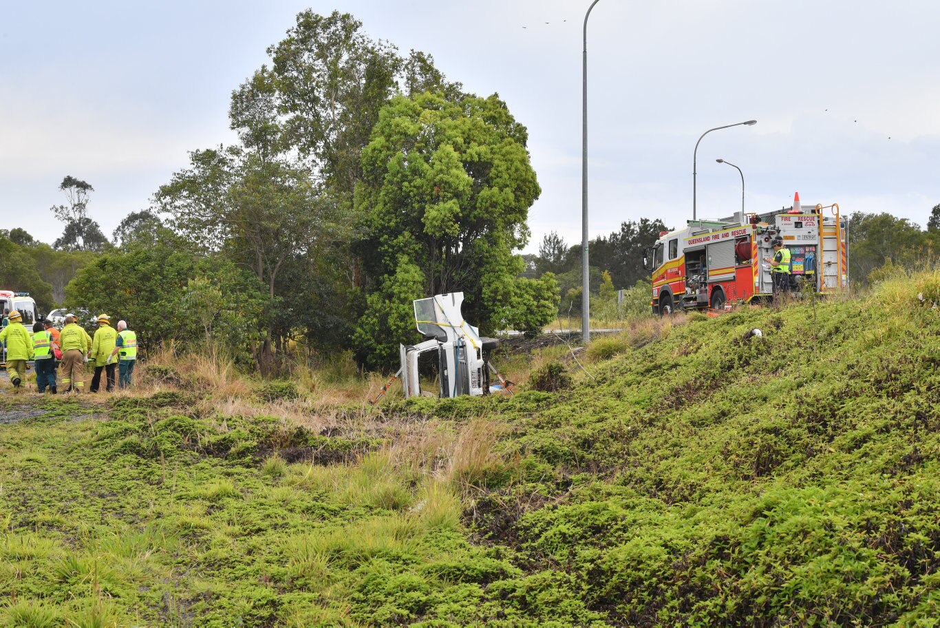 A 70 year old female was trapped inside their vehicle after it rolled on the Coolum-Yandina Road near the Coolum roundabout on the Sunshine Motorway. Photo: John McCutcheon / Sunshine Coast Daily