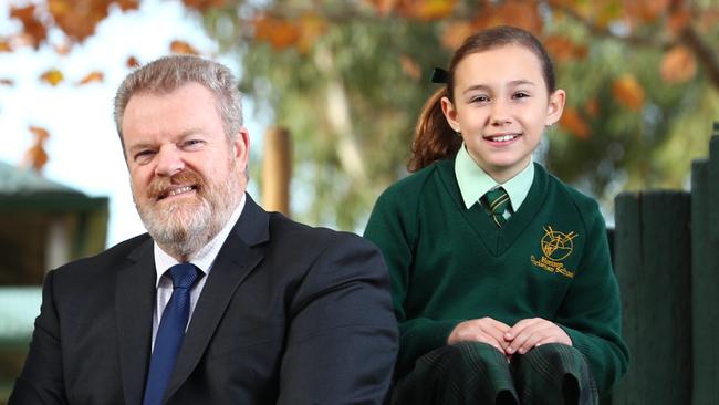 Horizon Christian School principal Michael Clisby with a student in 2018. Picture: Tait Schmaal