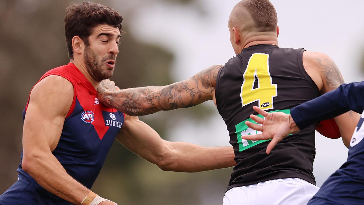 Martin gives Christian Petracca the don’t argue in 2021. Picture: Michael Klein