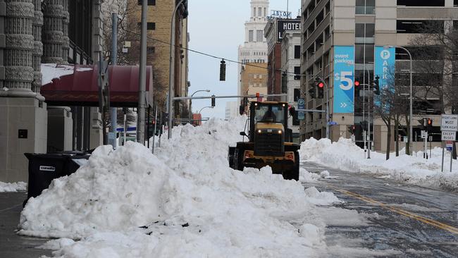 A loader clears piles of snow along a street in Buffalo, New York. Picture: Getty Images