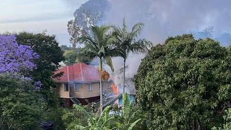 A single storey home up in flames in Mt Gravatt east Tuesday morning. Photo: Brett Jacobs