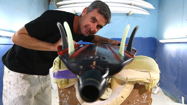 Dale Wilson from Byrning Spears surf board factory has designed a board with a Wilson Jet motor for big wave surfing Photo: David Clark