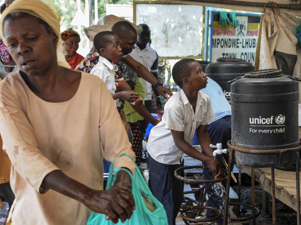 People coming from Congo wash their hands with chlorinated water to prevent the spread of infection, at the Mpondwe border crossing with Congo, in western Uganda Friday, June 14, 2019. Picture: Ronald Kabuubi