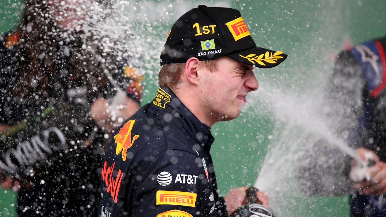 Race winner Max Verstappen celebrates on the podium. Picture: Charles Coates