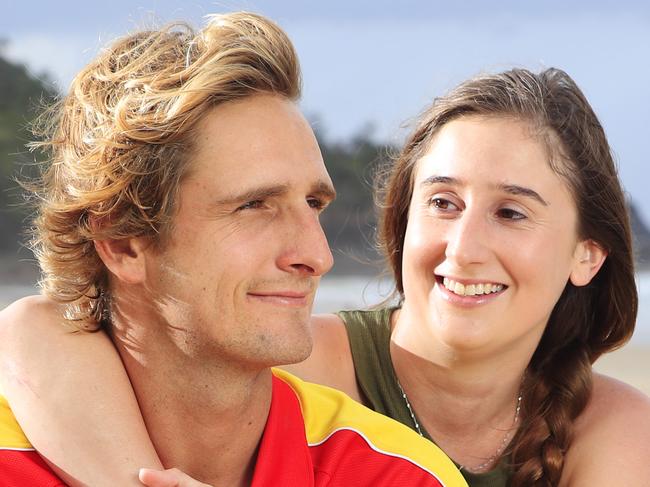 24 year old Stevi Everson with her Hero James Cervi 26, who she says 'definitely saved her life' as she came off her Dads Jetski in massive swells at Noosa's outer points on Sunday. Off Duty Noosa Lifeguard James swam to her aid, kept her afloat for over 20 minutes while 2 metre waves crashed on top of them relentlessly and swam her to a protected area where she was treated by paramedics and taken to hospital. Photo Lachie Millard