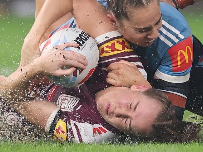 SYDNEY, AUSTRALIA - MAY 15: Tamika Upton of the Maroons is tackled by Kezie Apps of the Bluesduring game two of the Women's State of Origin series between the New South Wales Blues and Queensland Maroons at Allianz Stadium on May 15, 2025 in Sydney, Australia. (Photo by Cameron Spencer/Getty Images)