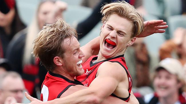 Essendon's Ned Cahill (right) celebrates his first goal with Essendon's Darcy Parish. Picture: Sarah Reed