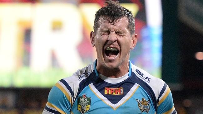 BRISBANE, AUSTRALIA - JULY 24: Greg Bird of the Titans shows his disappointment after Alex Glenn of the Broncos scores a try during the round 20 NRL match between the Brisbane Broncos and the Gold Coast Titans at Suncorp Stadium on July 24, 2015 in Brisbane, Australia. (Photo by Bradley Kanaris/Getty Images)