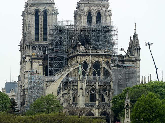 Firefighters carry out inspections on the damaged roof of Notre-Dame Cathedral following the inferno. Picture: Getty Images