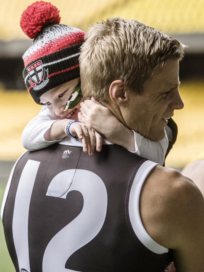 Nick Riewoldt with Elliott Vanderland, the 4-year-old fan diagnosed with aplastic anaemia who ran through the banner at Maddie's Match this year. Picture: Jason Edwards