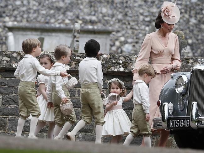 Catherine, Duchess of Cambridge, right, walks with the flower boys and girls, including Prince George, second right, and Princess Charlotte after the wedding of Pippa Middleton and James Matthews. Picture: Getty