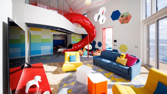 The three-level Ultimate Family Townhouse on board Royal Caribbean’s Icon of the Seas has a red slide from one level to the next. Picture:  Supplied.