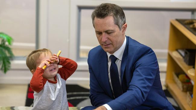 The Productivity Commission has warned that the most vulnerable children are missing out on early childhood education. Federal Education Minister Jason Clare is pictured with two-year-old Alexander Hawkes at a child care centre in Queanbeyan, NSW. Picture: Gary Ramage