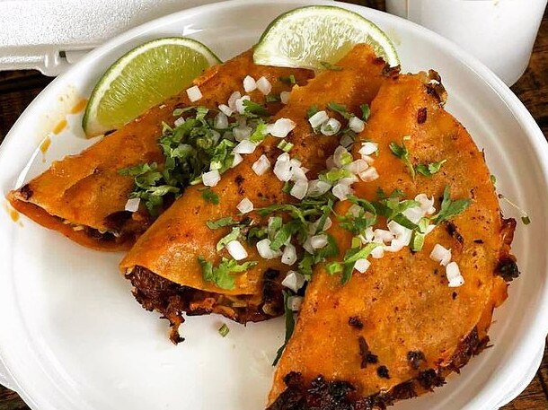 What makes birria queso tacos unique is how you eat them. The novelty of dipping the tacos into the broth and eating them in one bite. Picture: Chololo/Instagram