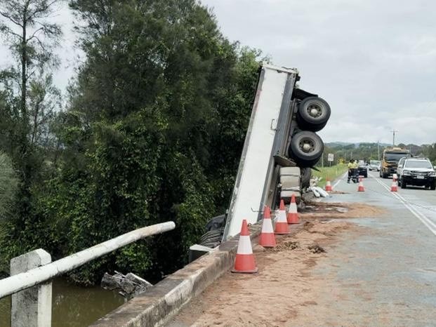 The cab of the truck became submerged in the river below.