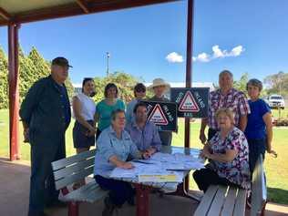 The Inner Downs Inland Rail Action Group prepares to send off their petition to Parliament yesterday morning. Picture: Contributed