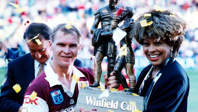 Alfie Langer and Tina Turner holding the Winfield Cup at the end of the 1993 Brisbane Broncos v St George Rugby League Grand Final at the SFS in Sydney.