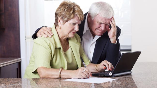 senior couple worrying about money