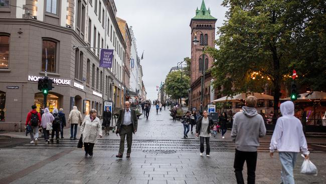 Pedestrians walk along Karl Johans Gate, the main shopping street in Oslo, in 2020. Photographer: Odin Jaeger/Bloomberg via Getty Images