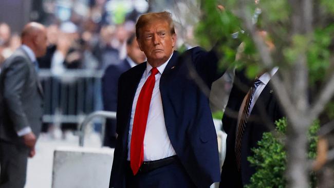 Mr Trump returning to Trump Tower in New York after his day in court on Monday. Picture: Michael M. Santiago/Getty Images via AFP