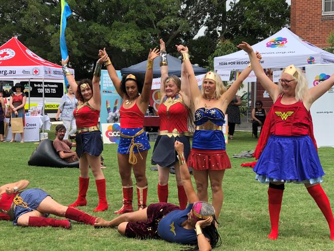 Wonder Women surprise the crowd in The Quad at the opening of the Lismore Women's Festival.