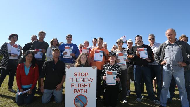 Stop the Instrument Landing System (ILS) spokesman Sven Puetter (right) and members of the public supporting the campaign during a meeting at Mermaid Waters, Gold Coast.