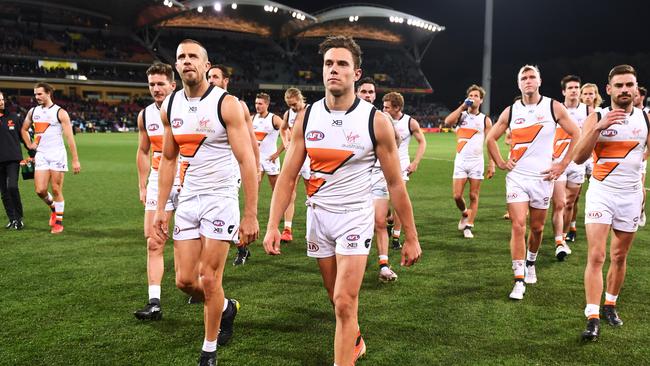 ADELAIDE, AUSTRALIA — JUNE 08: Dejected Giants leave the oval 2during the round 12 AFL match between the Adelaide Crows and the Greater Western Sydney Giants at Adelaide Oval on June 08, 2019 in Adelaide, Australia. (Photo by Mark Brake/Getty Images)