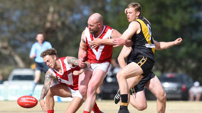 Healesville's Jaden McGrath and Simon Gordon do battle with Woori Yallock's Luke Boontjes. Picture: Josie Hayden